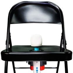Black folding chair with wand vibrator in center hole