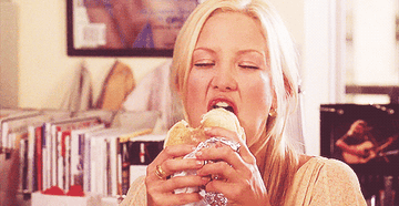 Kate Hudson eating a burger