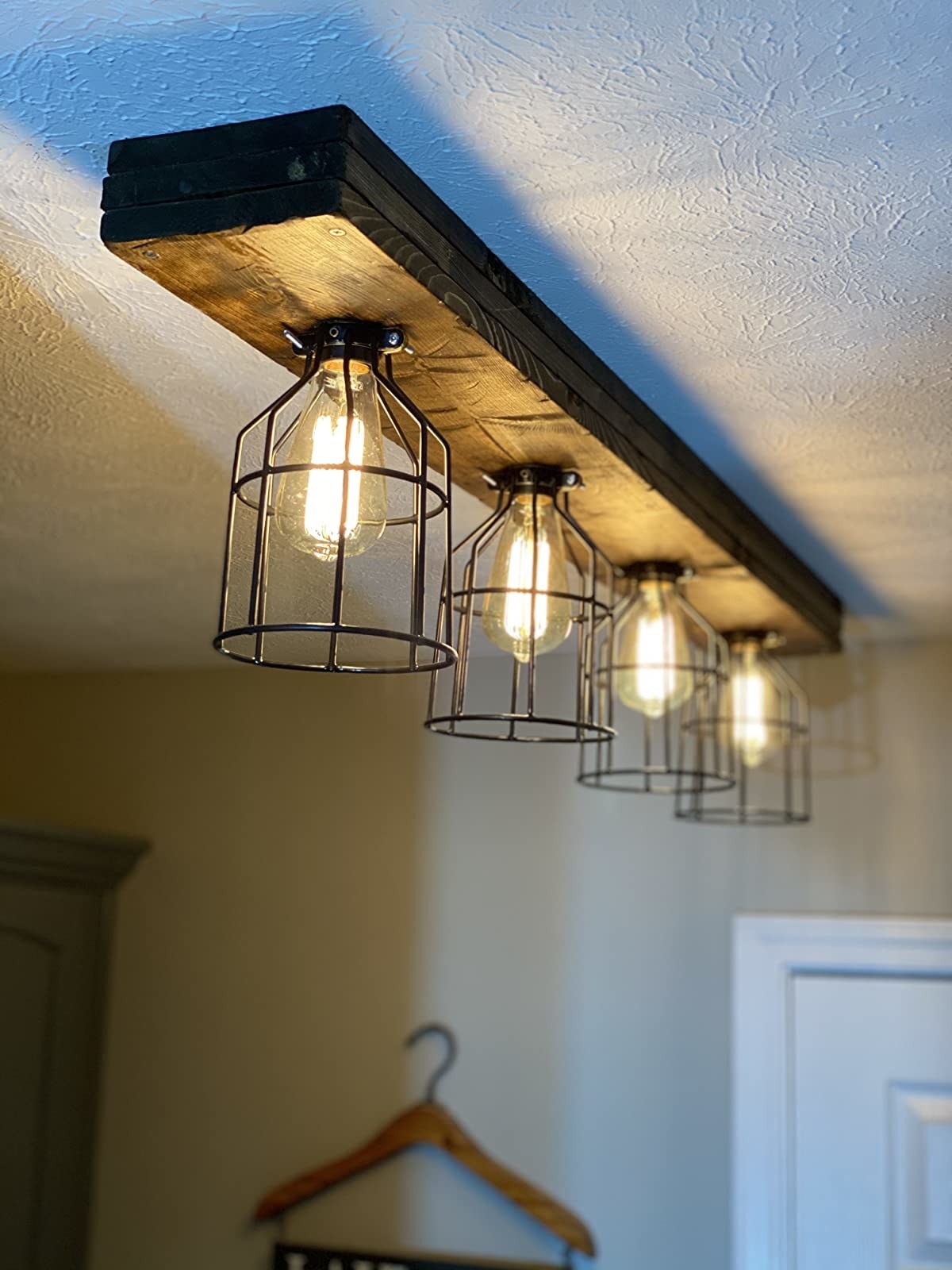 the four cage light fixtures