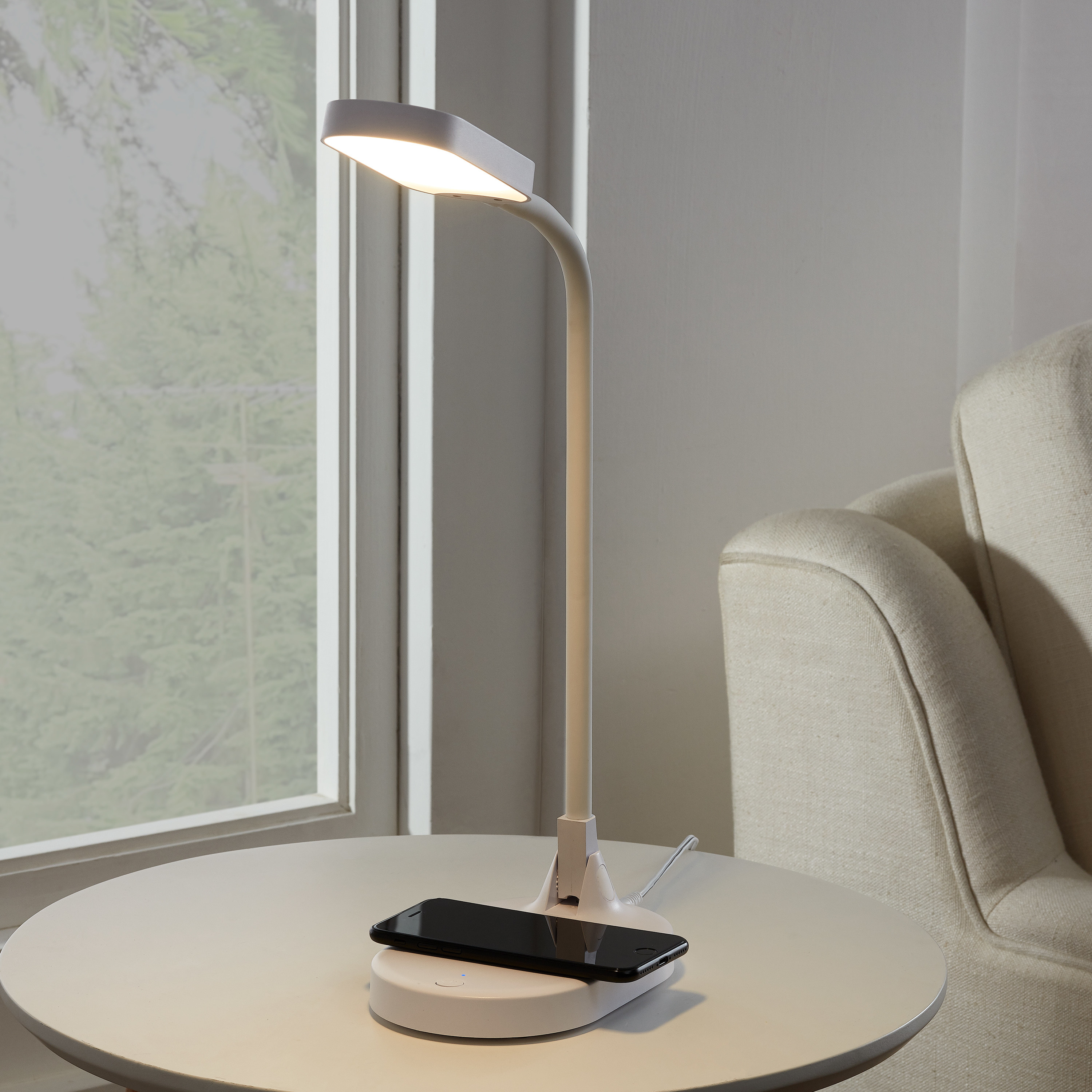 simple lamp with a charging base for a phone