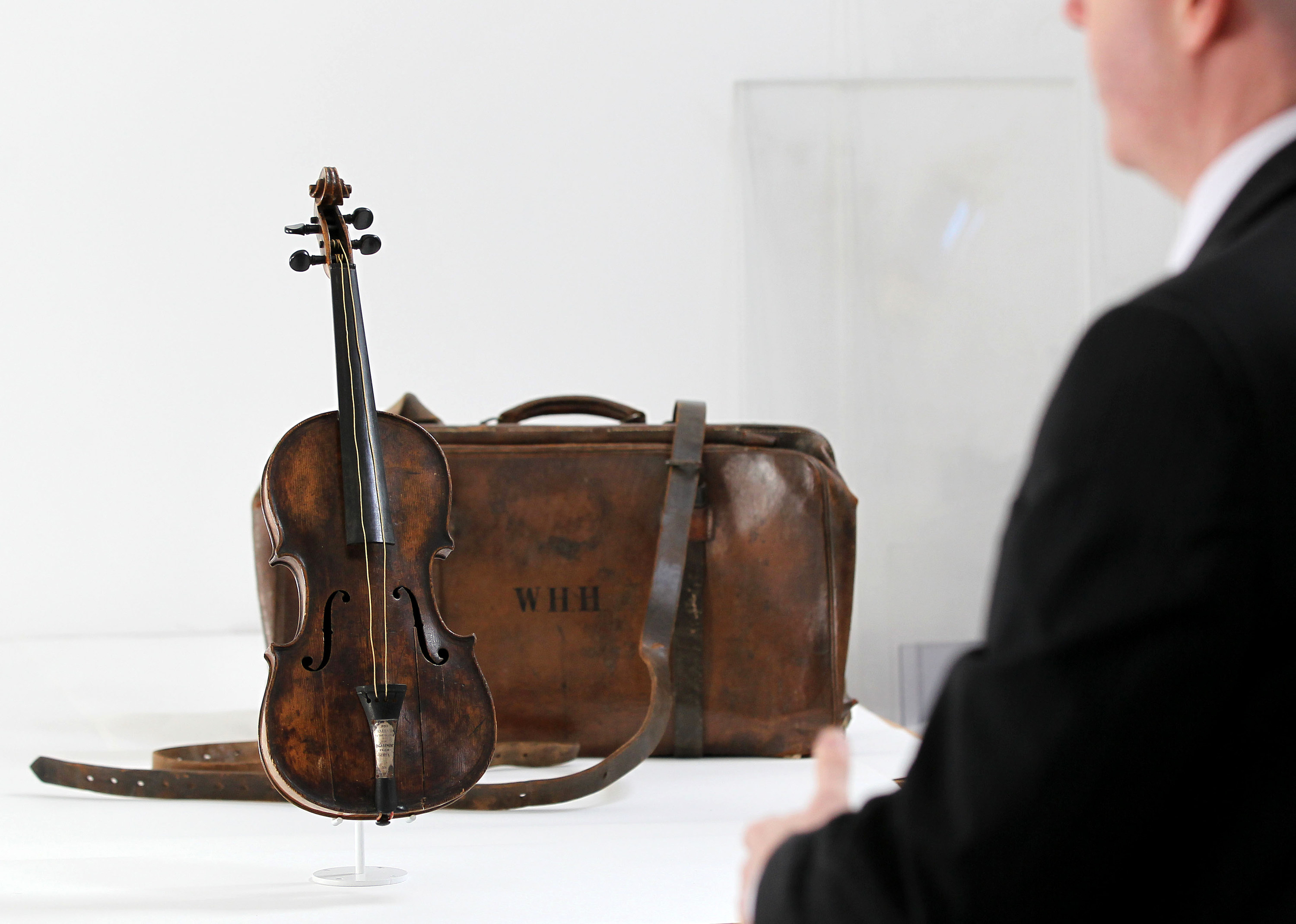 An old violin on display in a museum