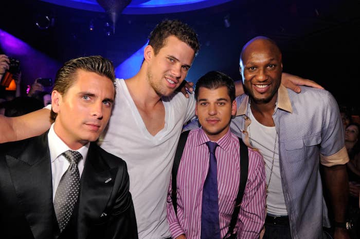 Scott, Rob, Lamar, and Kris Humphries pose together at a club