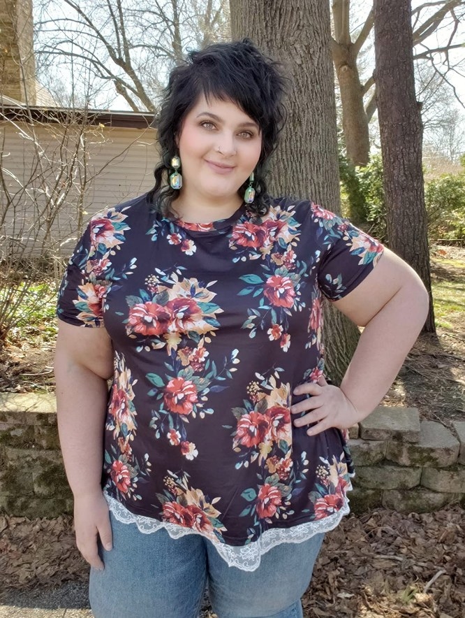 A reviewer wearing a women&#x27;s lace, flowy, a-line tunic shirt in &quot;12_floral_l&quot;
