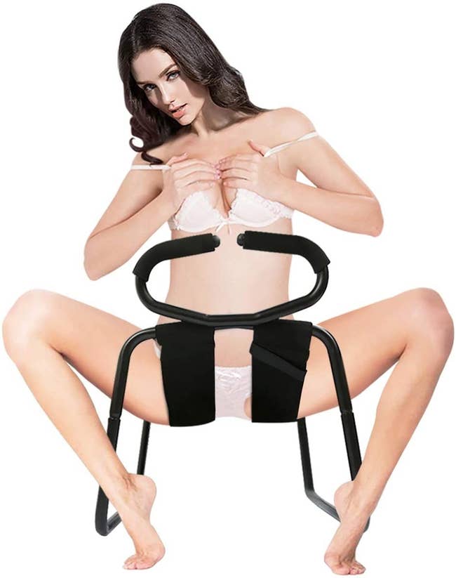 Model sitting on black stool