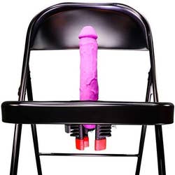 Folding chair with pink realistic dildo in center hole