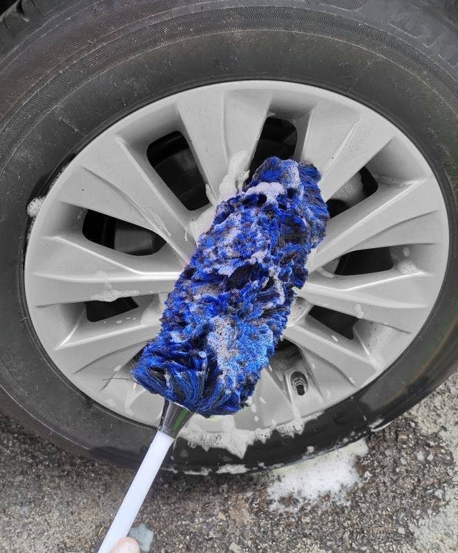 reviewer photo of someone using the tire wool brush to clean their tire