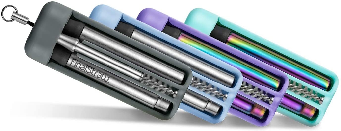 the straws and their cleaning brushes in black, blue, purple, and mint carrying cases