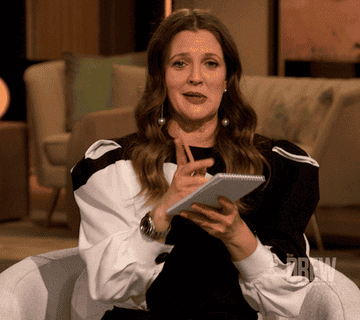 Gif of Drew Barrymore taking notes