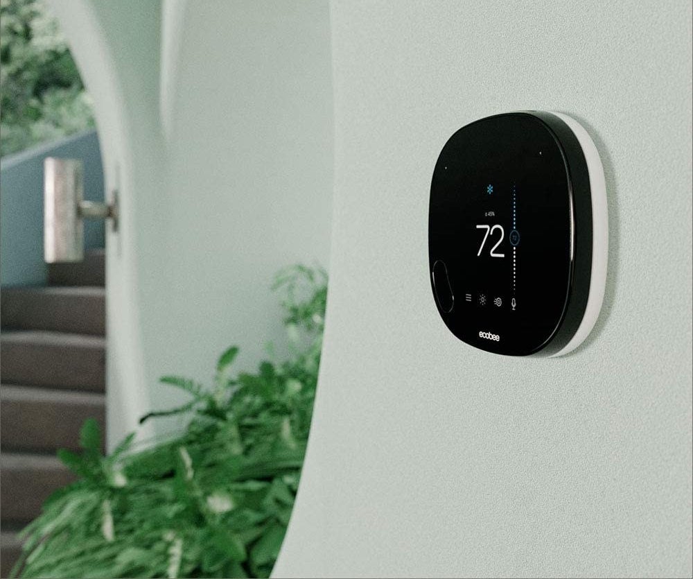 the thermostat displayed on a wall