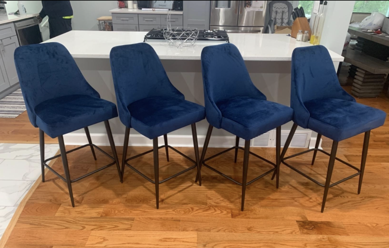 Reviewer&#x27;s kitchen with four of the barstool chairs next to their kitchen island
