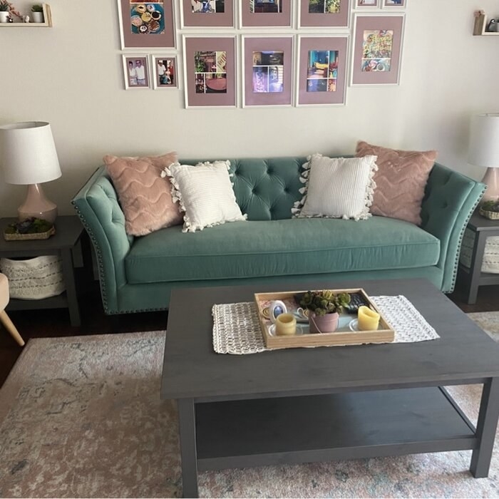 The flare-armed sofa with throw pillows