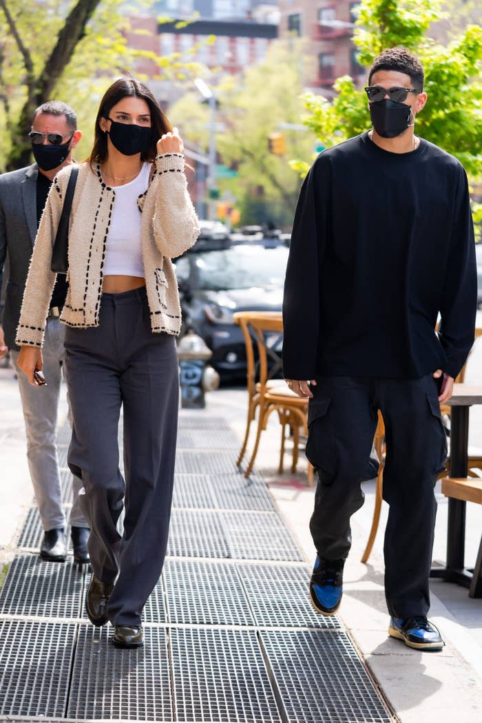 Kendall Jenner and Devin Booker walk down the streets of New York while wearing masks