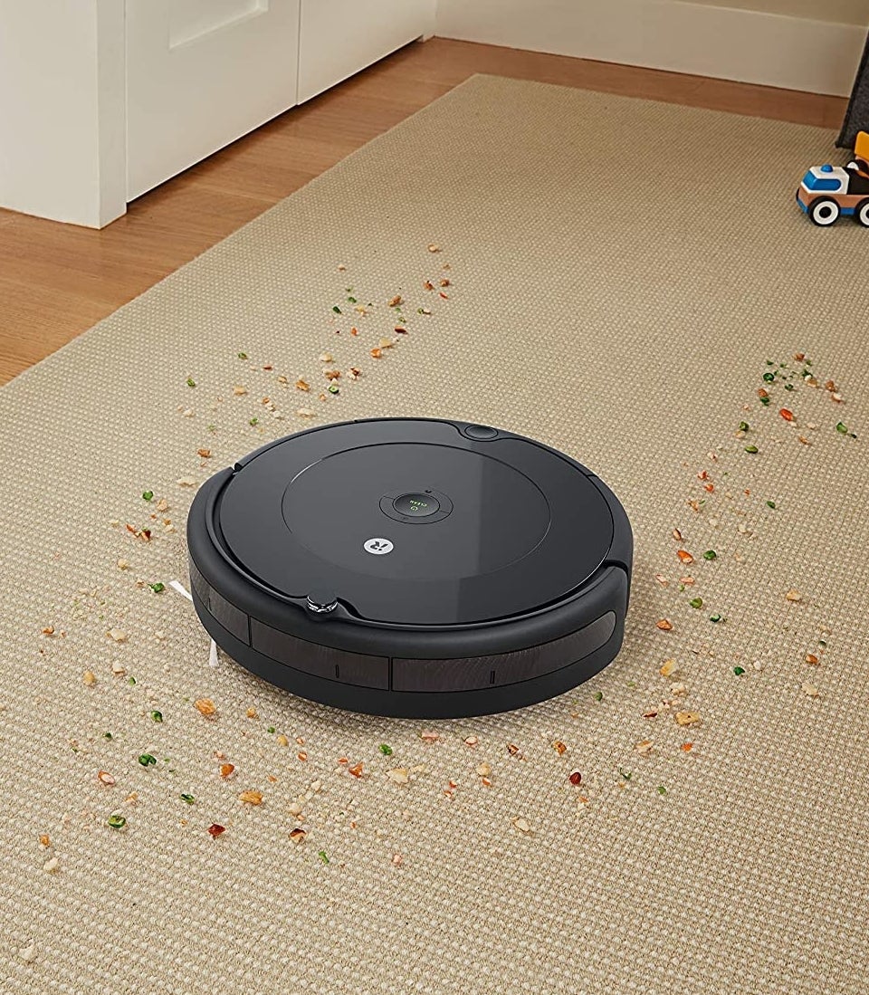 the robot vacuum cleaning up debris