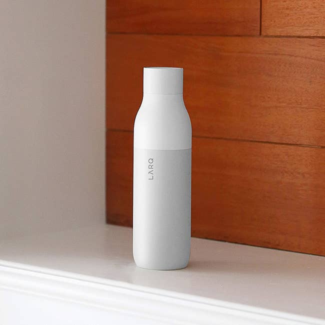 a white larq water bottle
