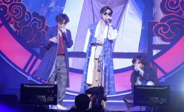 The rap line of BTS wear hanbok and perform onstage