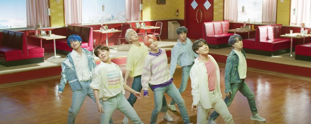 BTS wear pastel clothes and dance in a retro diner in the Boy With Luv music video