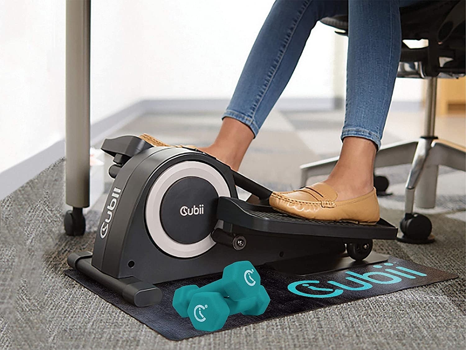 a person using the under-desk pedal machine while working