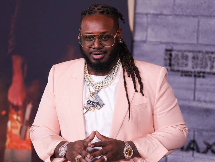 T-pain wears a pink jacket at an event
