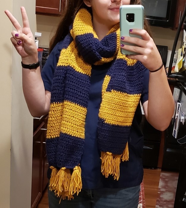 Woman posing with homemade striped scarf