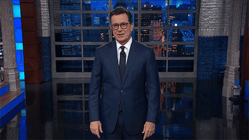 Stephen Colbert forces himself to smile and give a thumbs-up to the camera on the set of &quot;The Late Show With Stephen Colbert&quot;