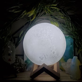 the moon lamp on a wooden stand