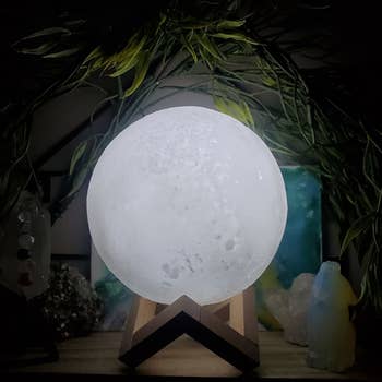 the moon lamp on a wooden stand