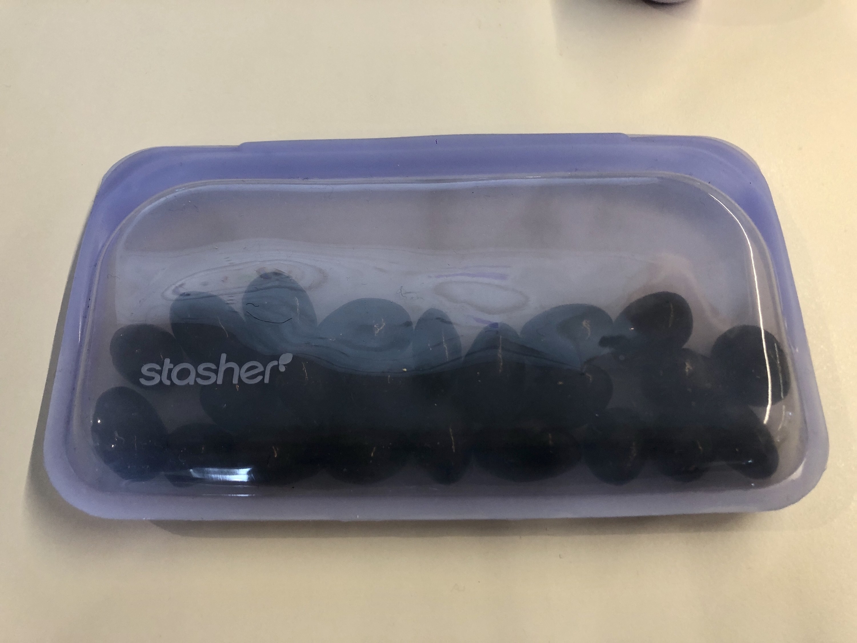 buzzfeed writer&#x27;s stasher bag in purple filled with almonds