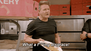 Gordon ramsay holding a plate of food and doing what he does best - cursing