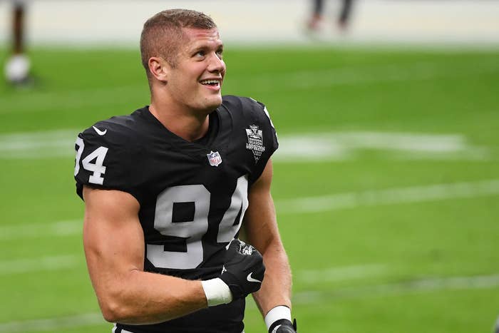 Carl Nassib in a Raiders jersey and smiling