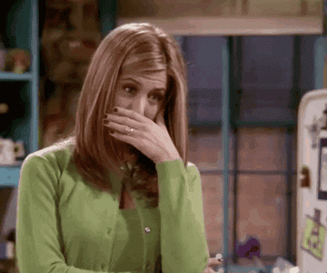 Rachel from &quot;Friends&quot; covering her mouth and laughing