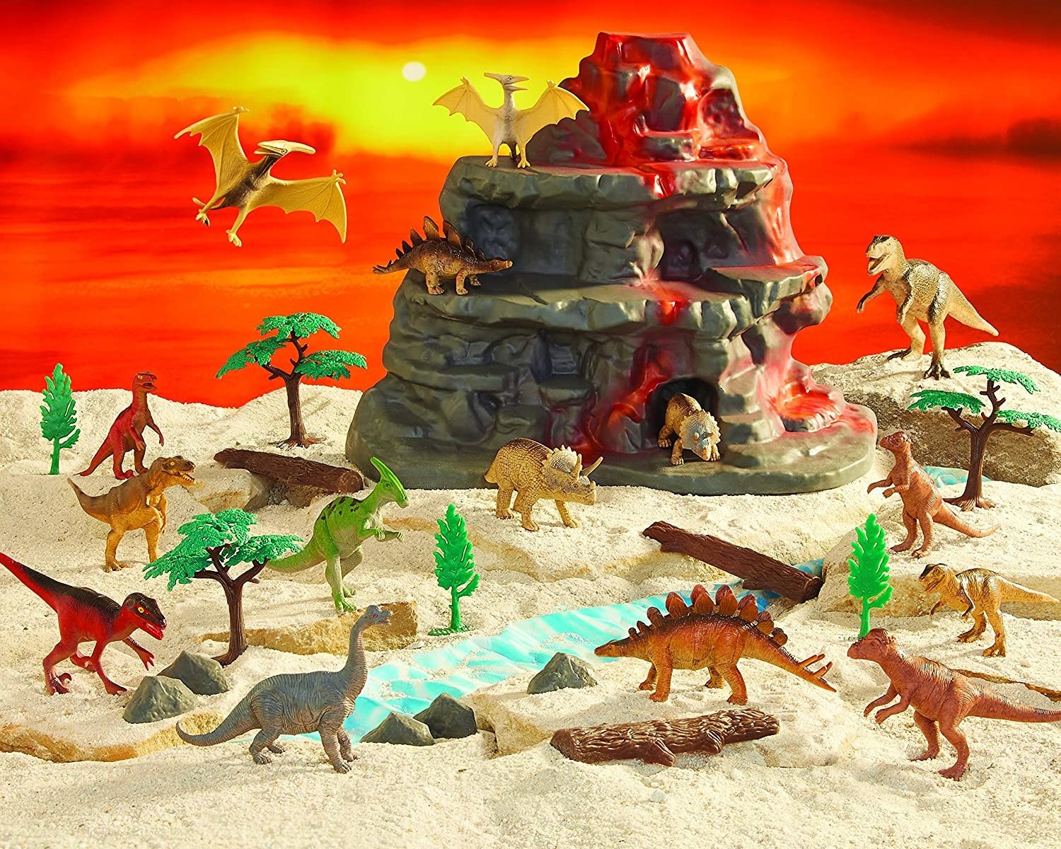 Plastic dinosaurs on and around a plastic volcano