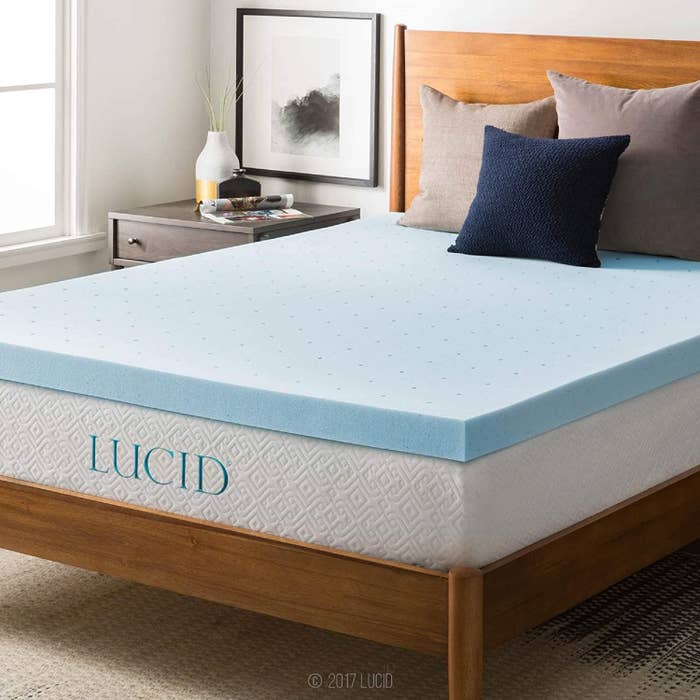 The blue mattress topper on a bed