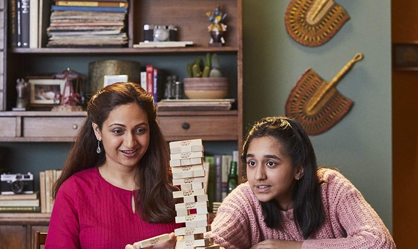 Two people playing Jenga