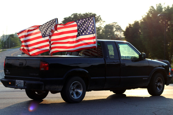 Car with two massive American flags