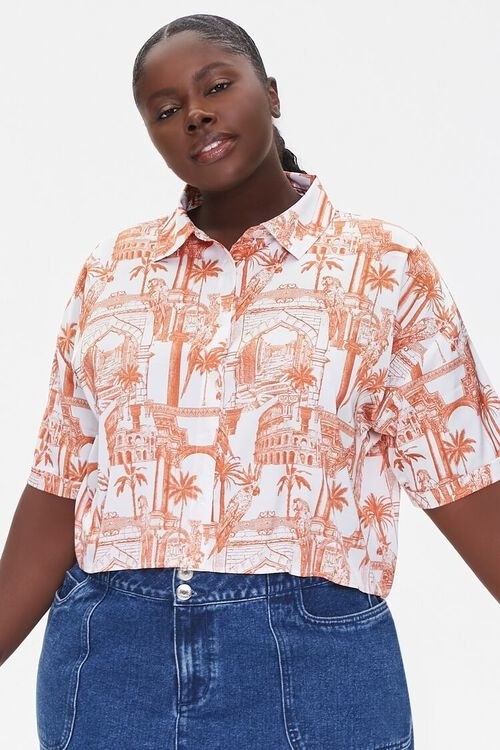 short sleeve shirt with pattern of buildings, palm trees, and cockatoos