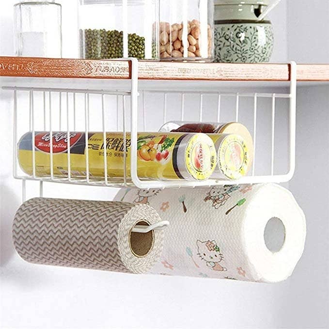 Kitchen towels hanging off the storage rack.