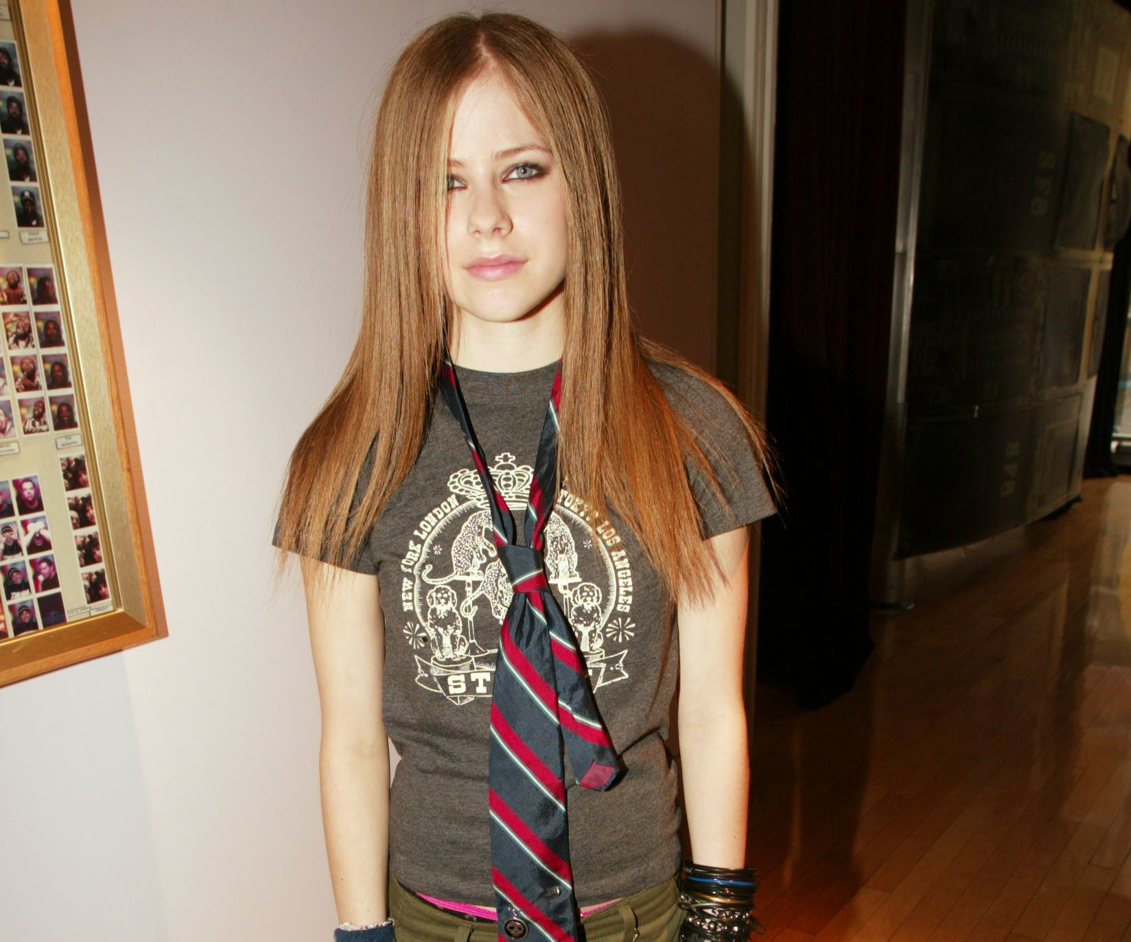Avril wears a similar tie on top of a T-shirt back in 2002