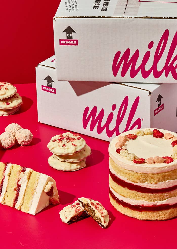 cookies, cakes, and truffle balls next to milk bar box
