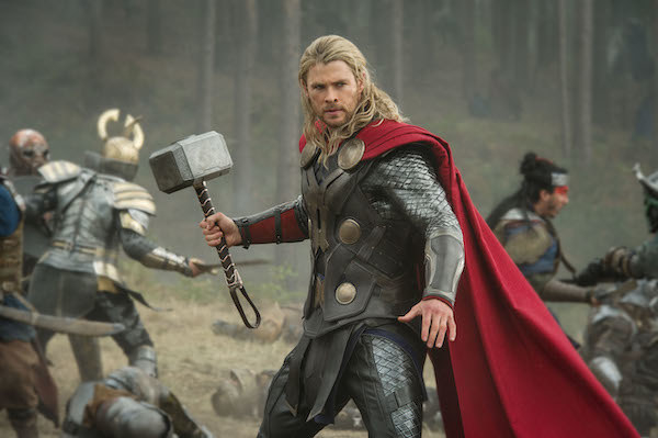 Chris Hemsworth holding a massive hammer during battle
