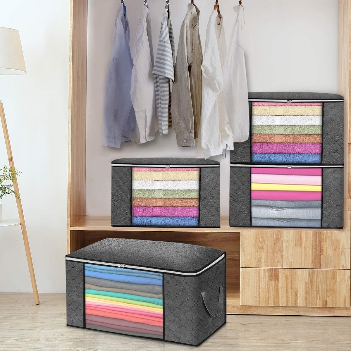 Four large storage cubes with various items inside