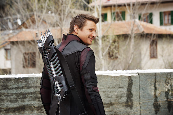 Jeremy Renner laughing at something offscreen