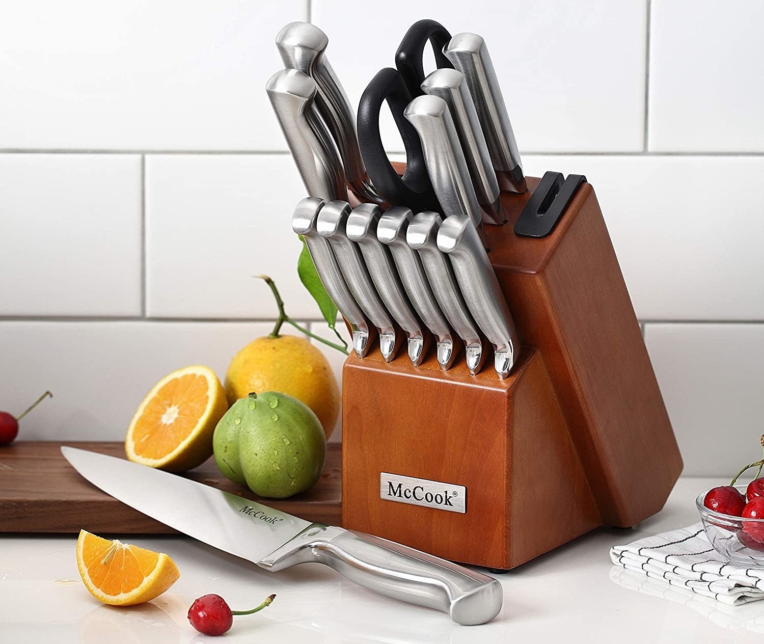 a wooden knife block filled with knives that&#x27;s sitting on a countertop