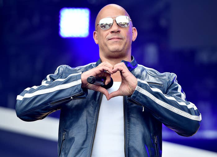 Vin Diesel makes a heart with his hands on stage