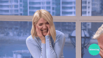 Holly Willoughby and Phillip Schofield laughing very hard