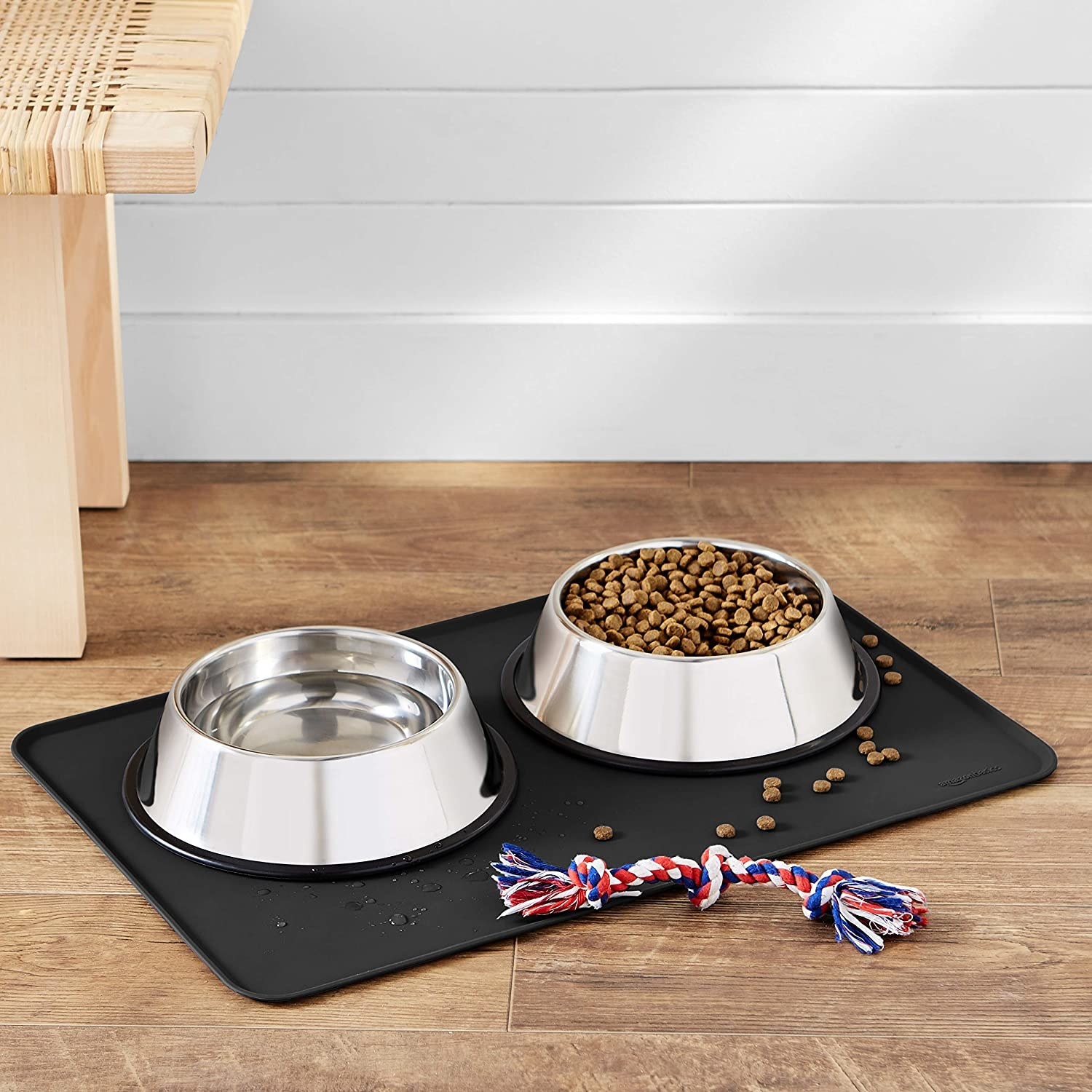 Two dog bowls placed on anti-slip mat