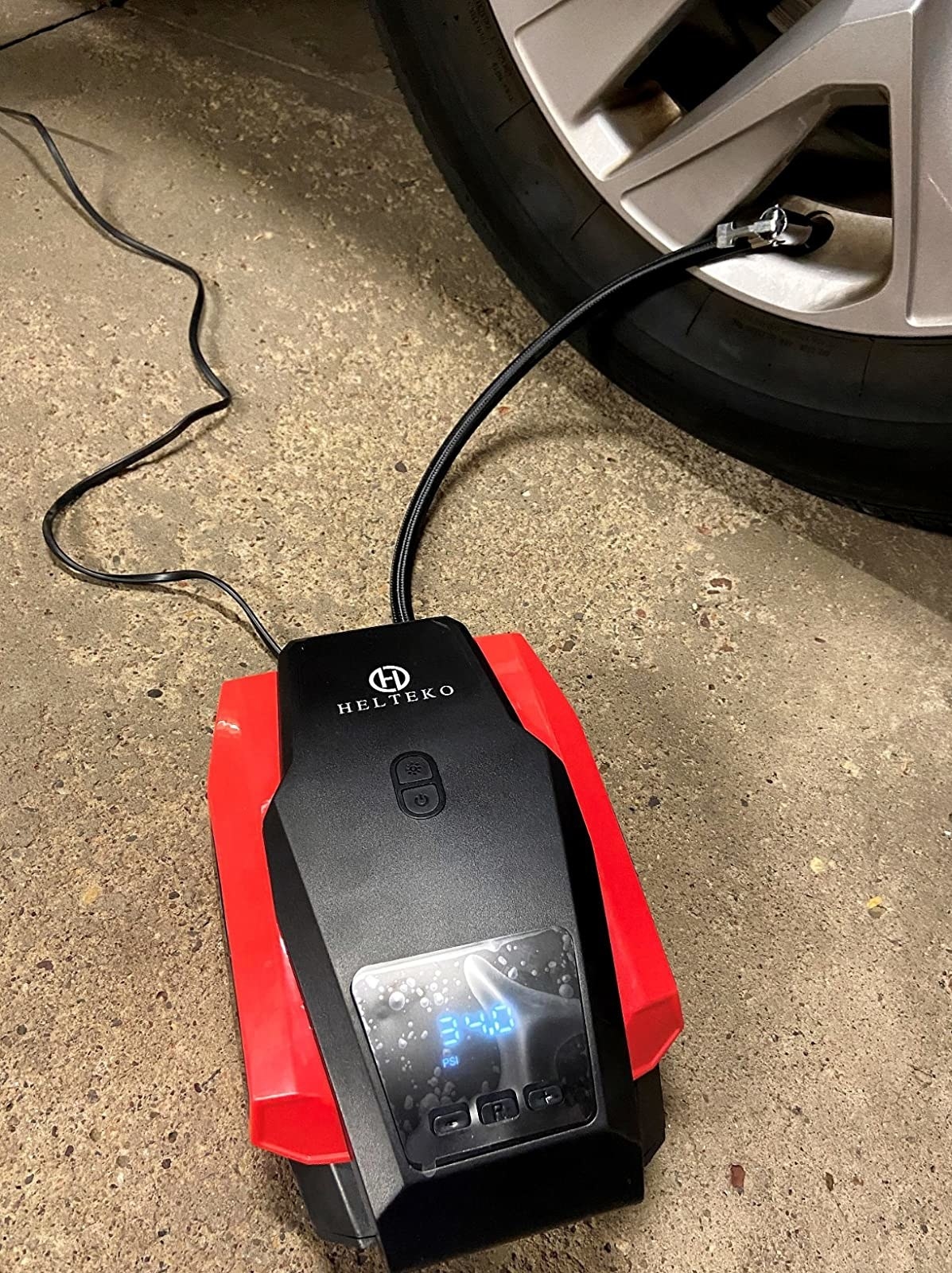 a review photo of the portable inflator inflating a tire