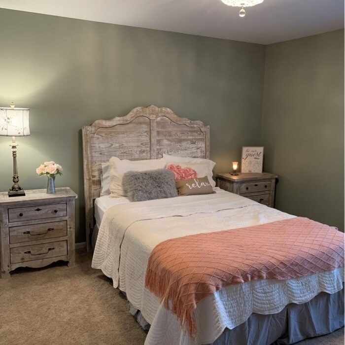 The bed frame with bed made up in a reviewer's bedroom