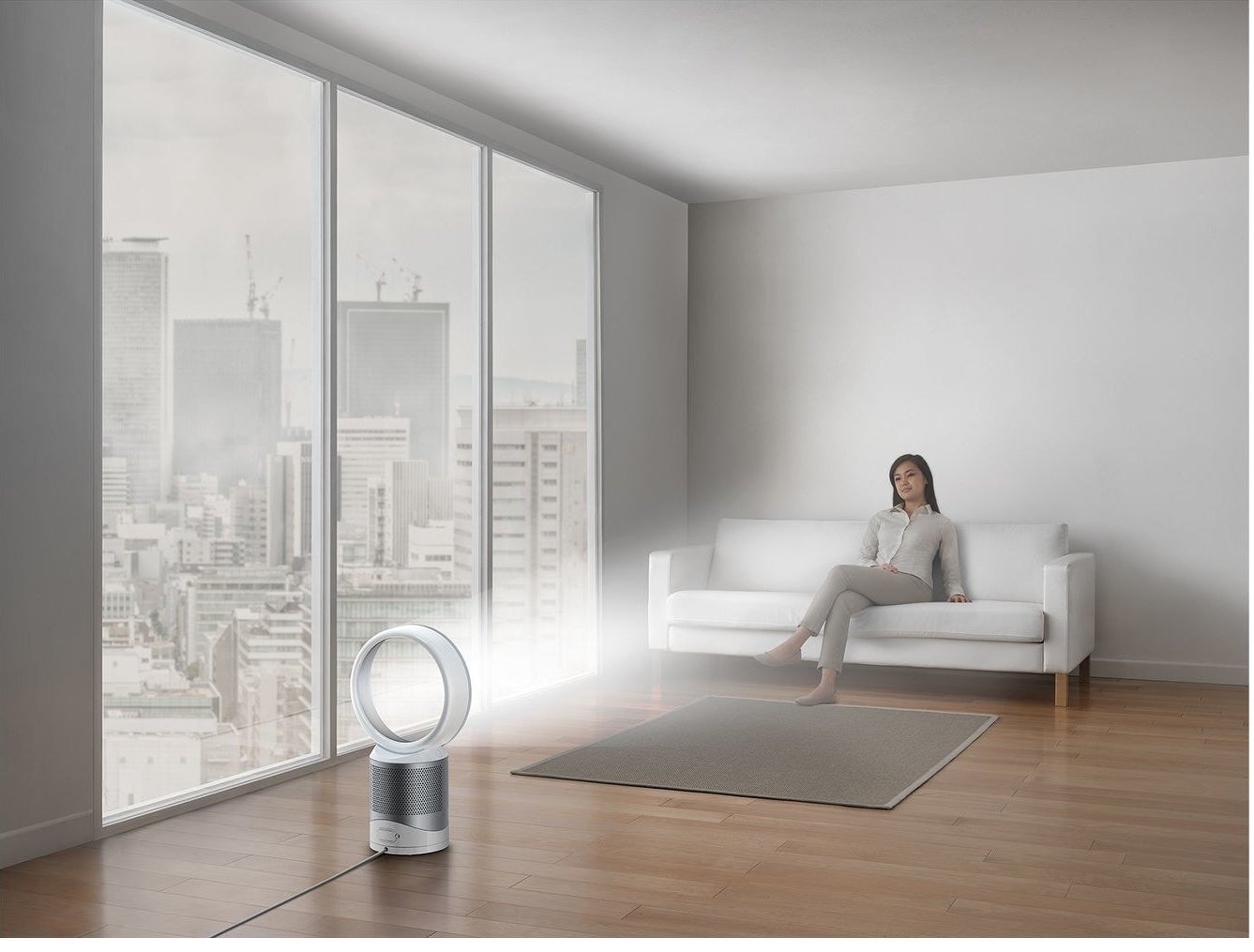 dyson air purifier and fan with circular design in a room with a model