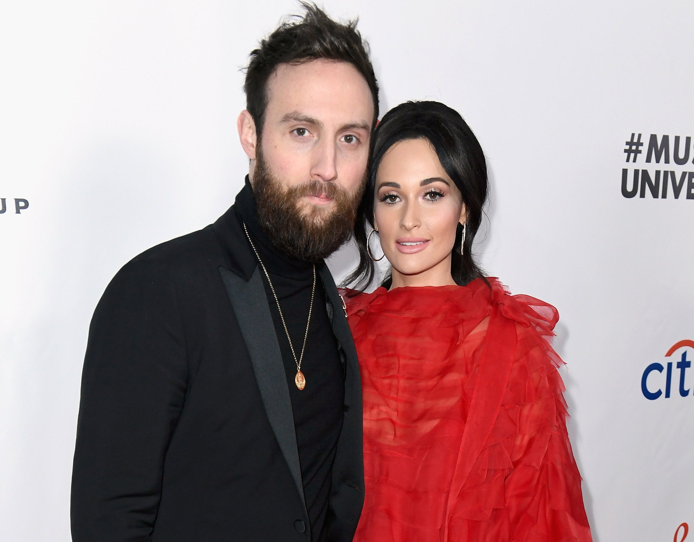 Kacey posing with ex Ruston at an event