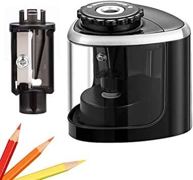 The pencil sharpener with the extra blades on display and colored pencils